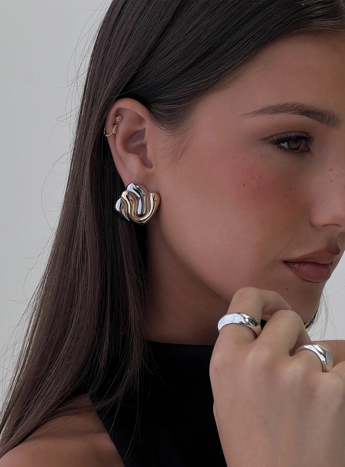 woman wearing new year's eve earrings