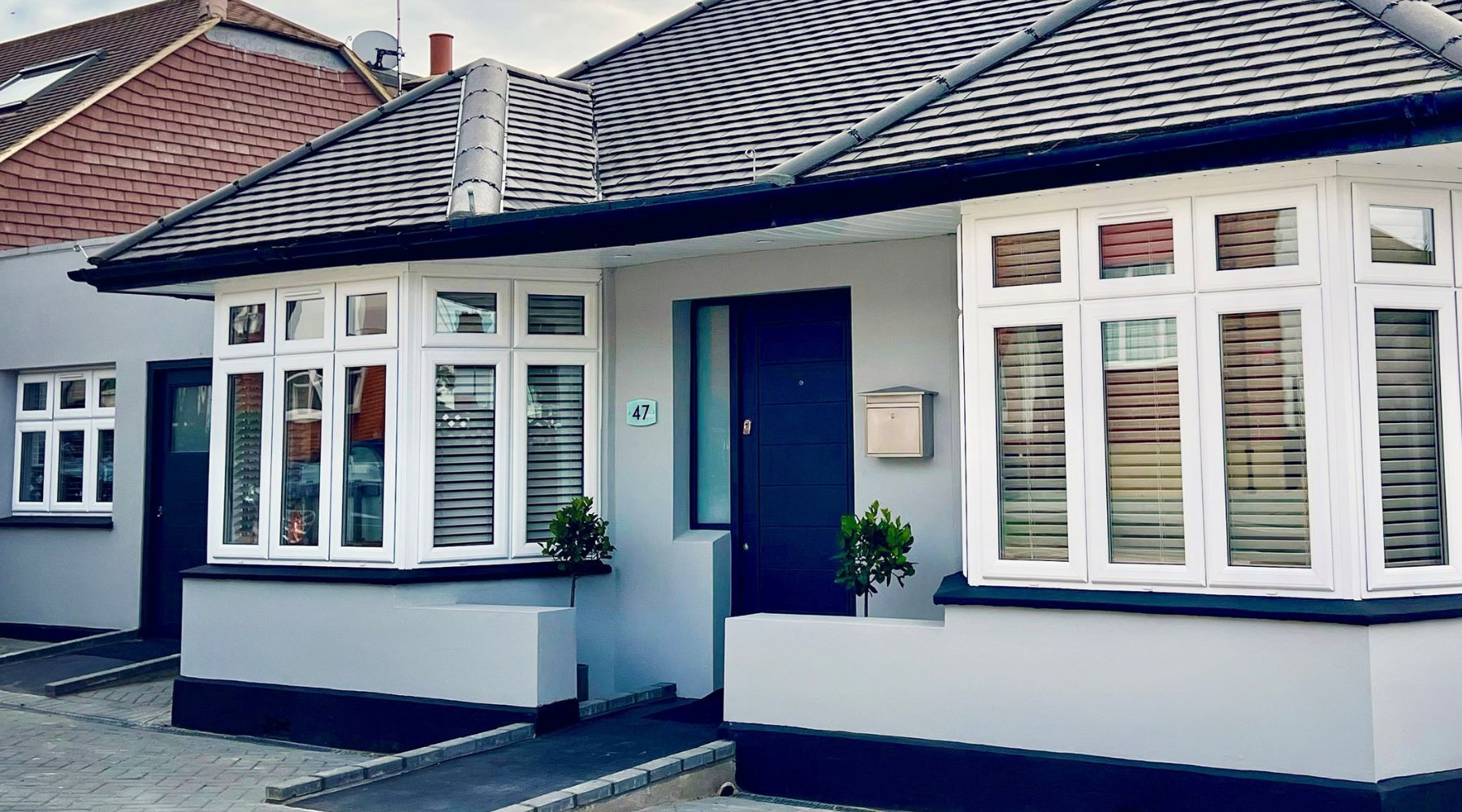 AbleStay exterior - a single storey dwelling with a ramp to the front door. 