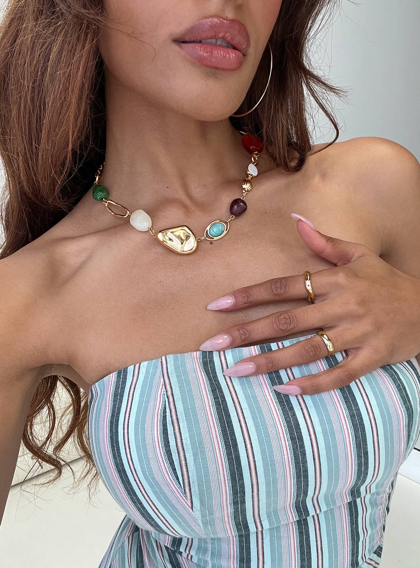 model wearing Princess Polly beach vacation jewelry