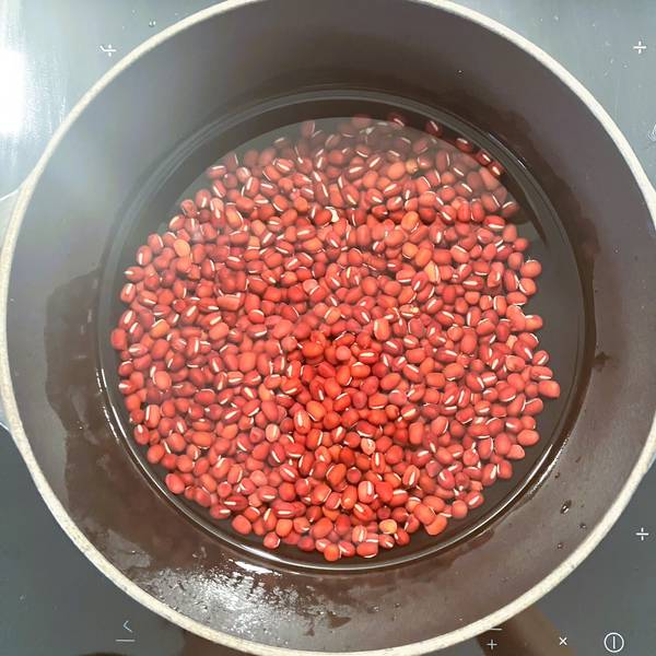 cooking the beans in a pot