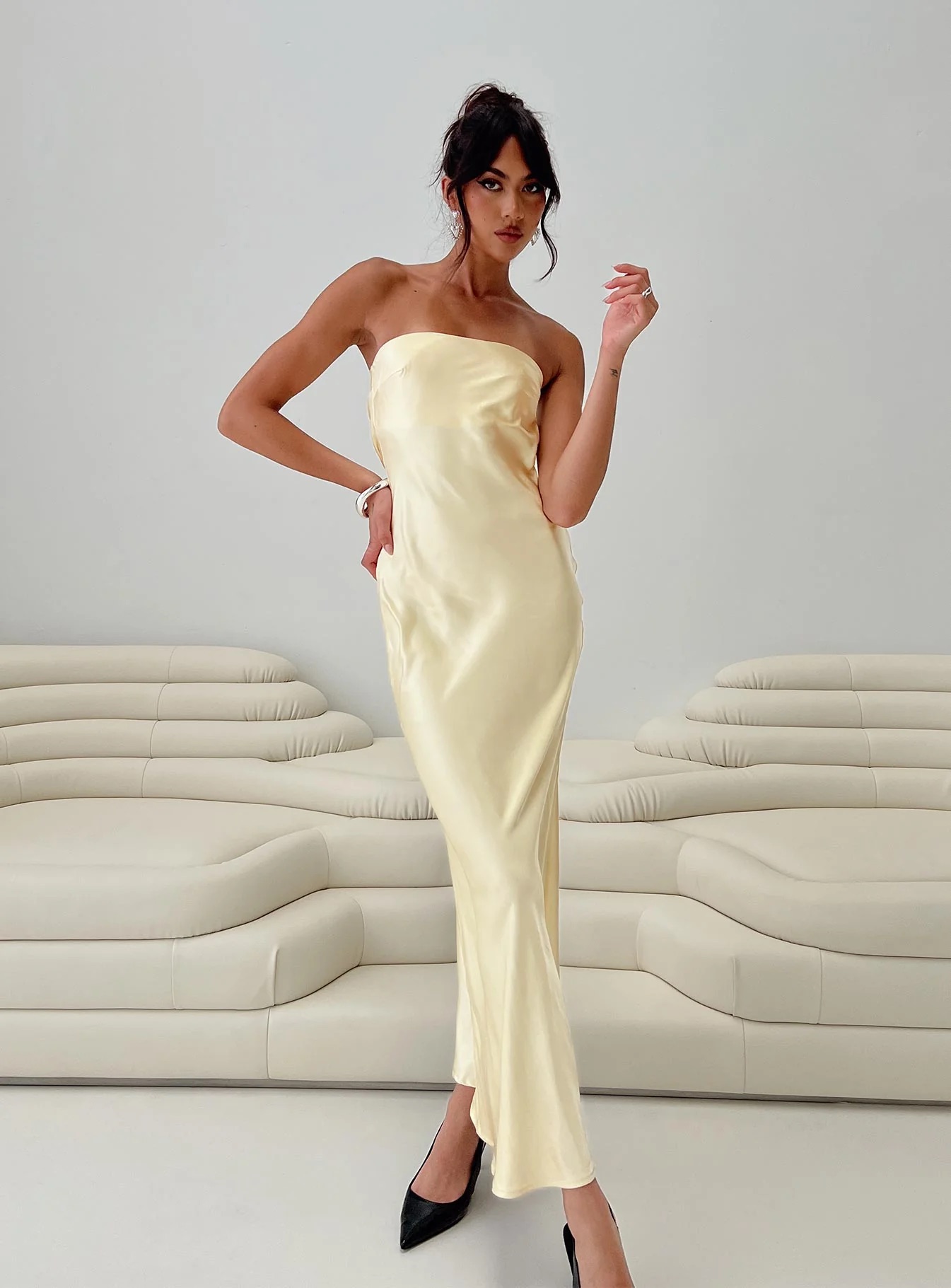 woman wearing yellow strapless dress to black tie spring wedding