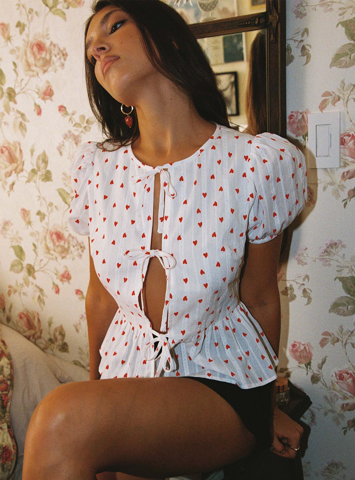 woman wearing a bow tie top to valentine’s day lunch date