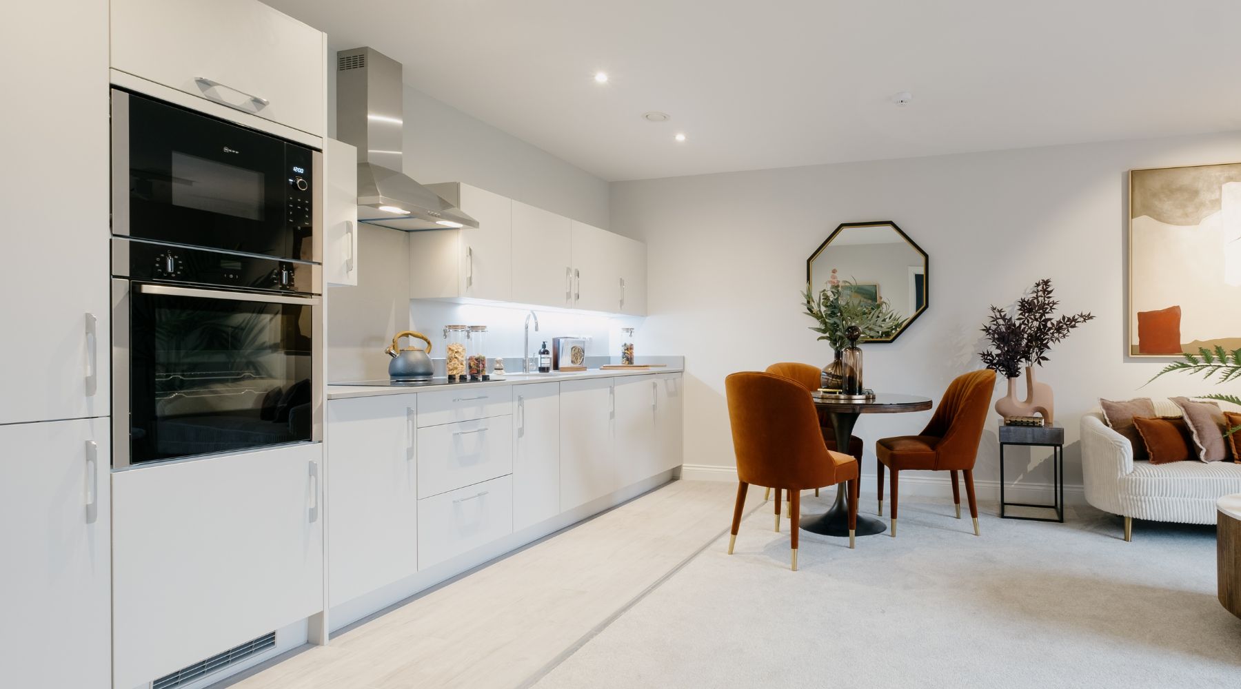 Trinity Lodge future-proofed, accessible apartment, open plan kitchen/dining/living area featuring Side and Hide oven, ceramic hob, integrated fridge/freezer and plentiful easy-access storage 