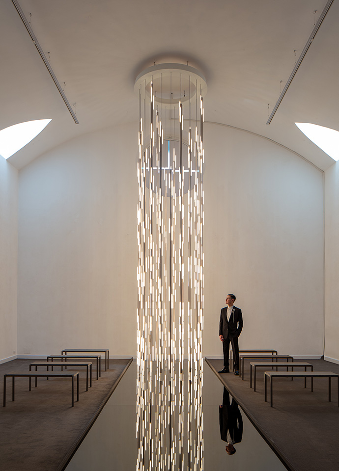 Lee Broom's installation 'Divine Inspiration' showed a series six new lighting collections at Blindarte, a former church, in the Brera district of Milan. Here, 'Chant', inspired by pressed glass bricks, transformed the crypt into a glowing chandelier that illuminated the interior. Photo c/o Lee Broom.