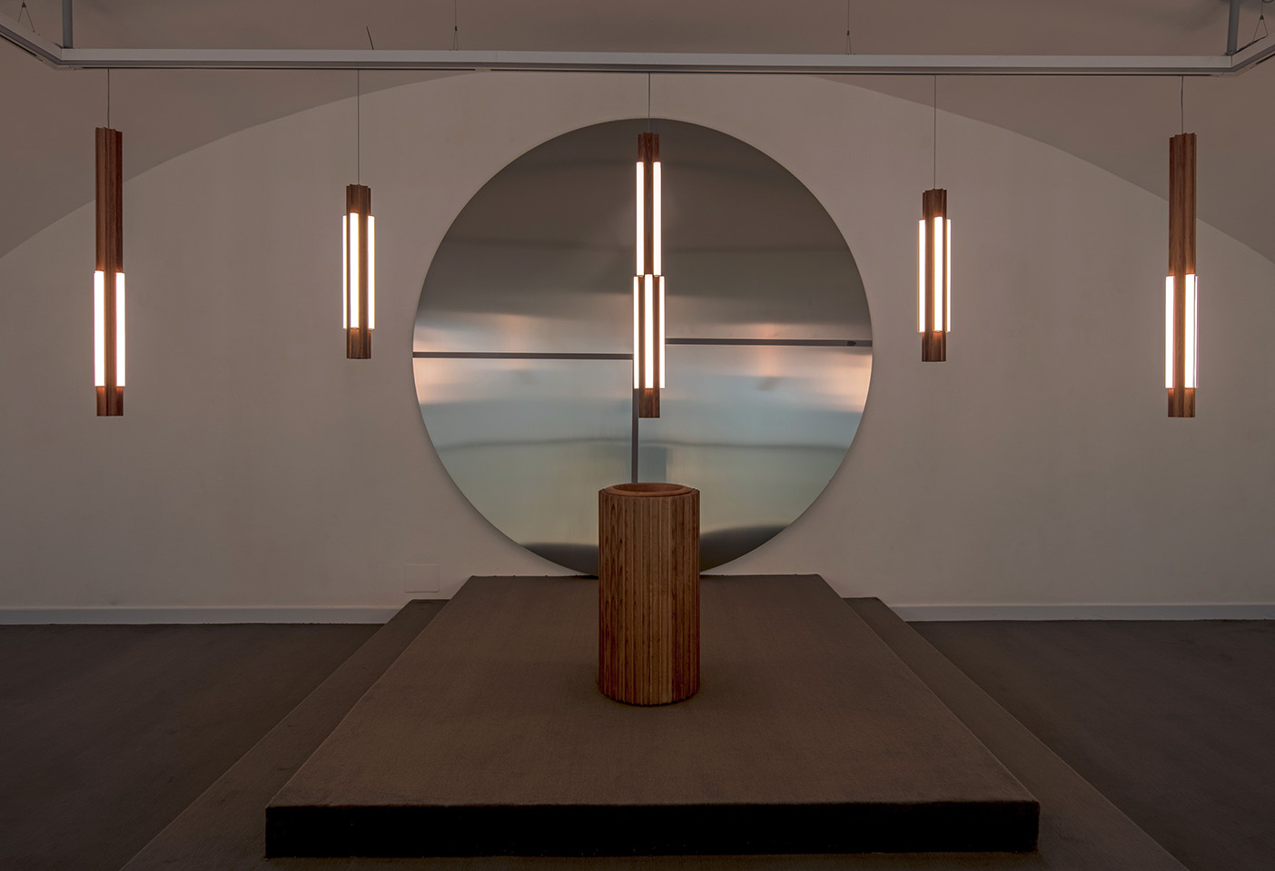 'Altar' references the angular forms of mid-century churches and altars, carved from solid oak and completed with an illuminated tube nestled in its architectural grooves. Photo c/o Lee Broom. 