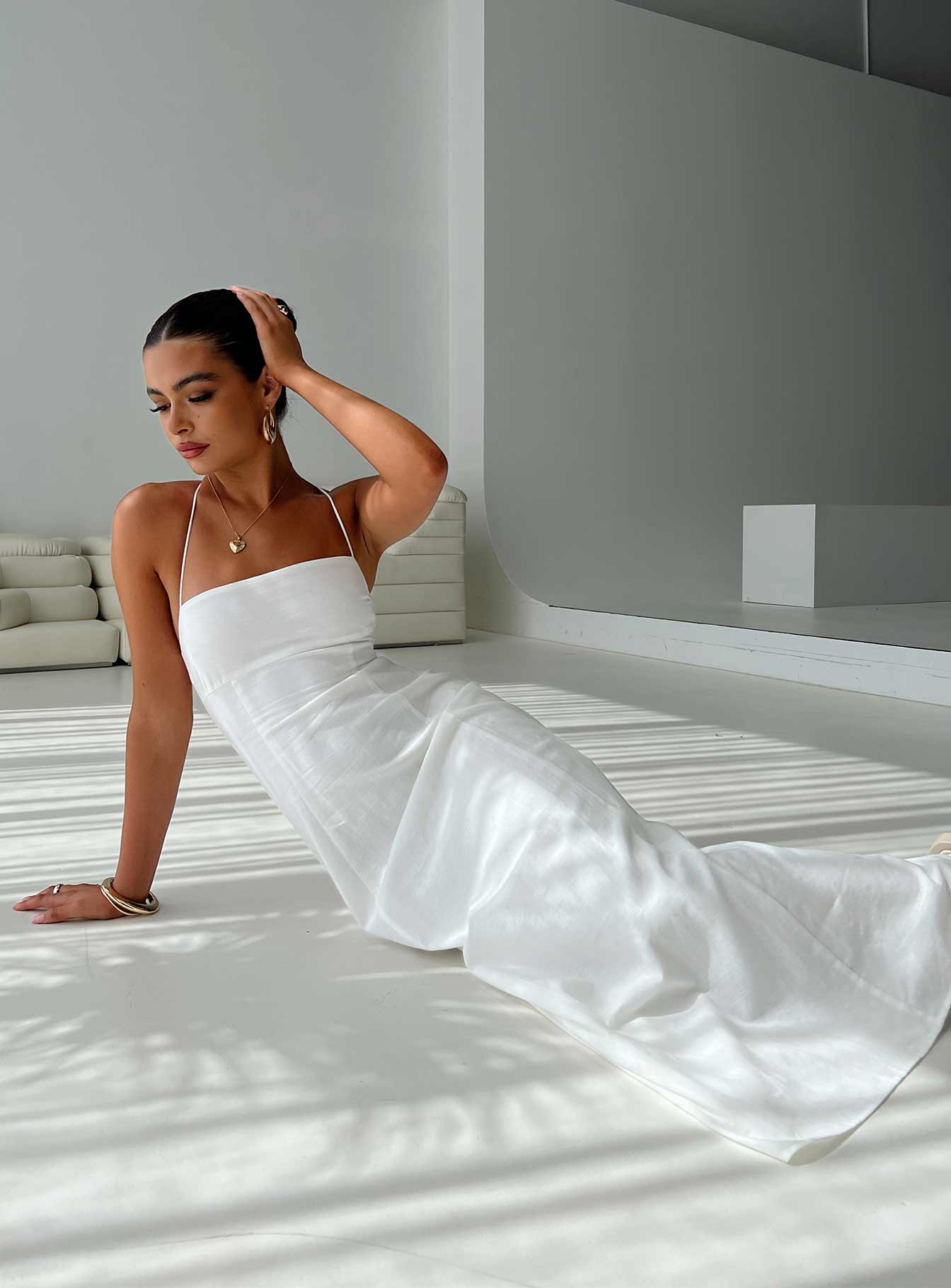 woman wearing white maxi graduation dress