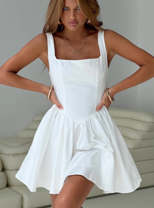 woman wearing white mini graduation dress