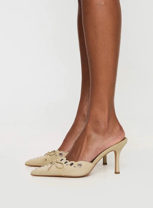 woman wearing nude heels for graduation
