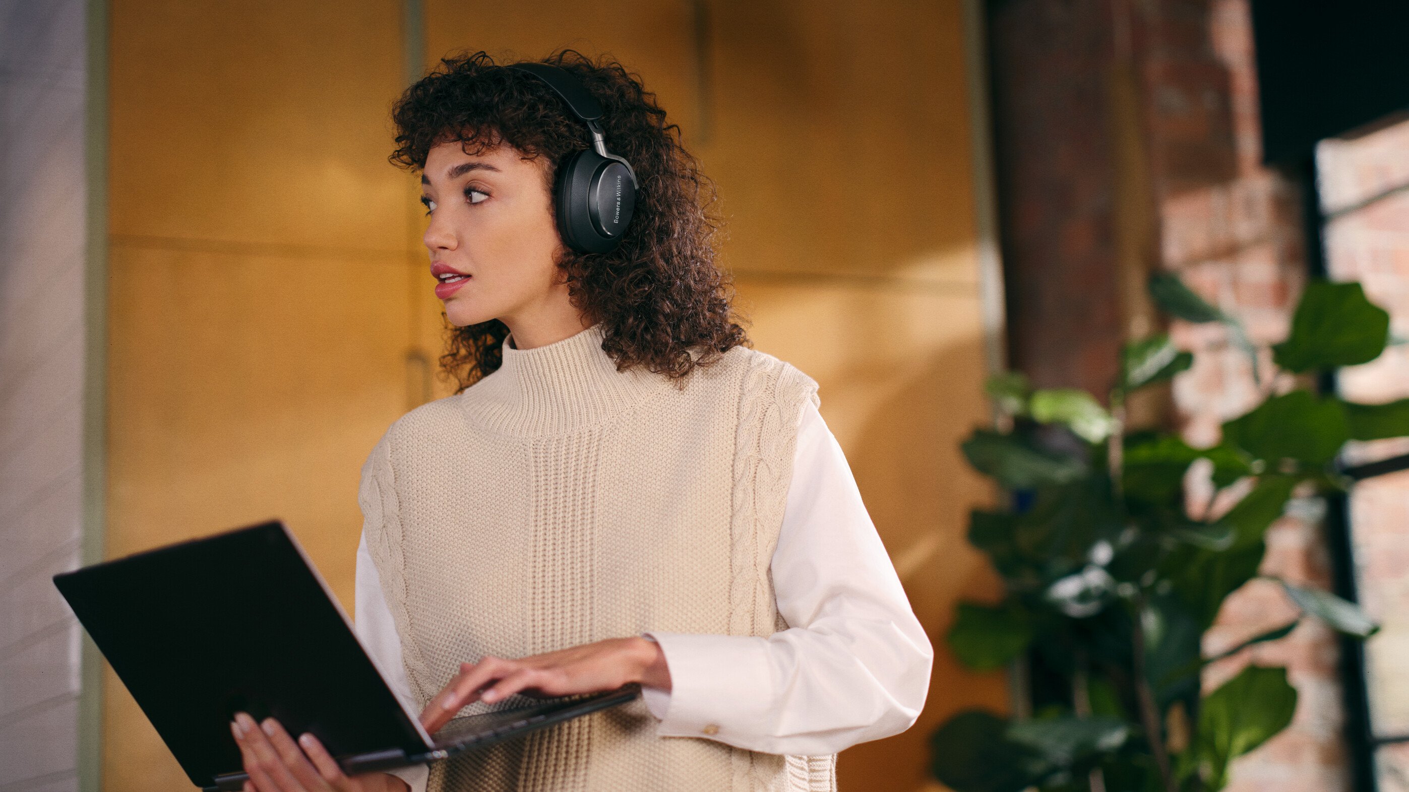 
Woman wearing Black Bowers & Wilkins Px8