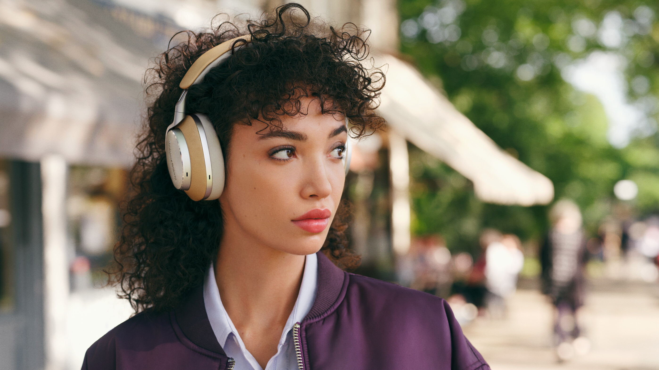 Woman wearing Tan Bowers & Wilkins Px8