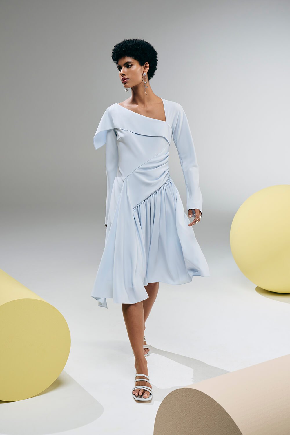 Model wears a baby blue dress