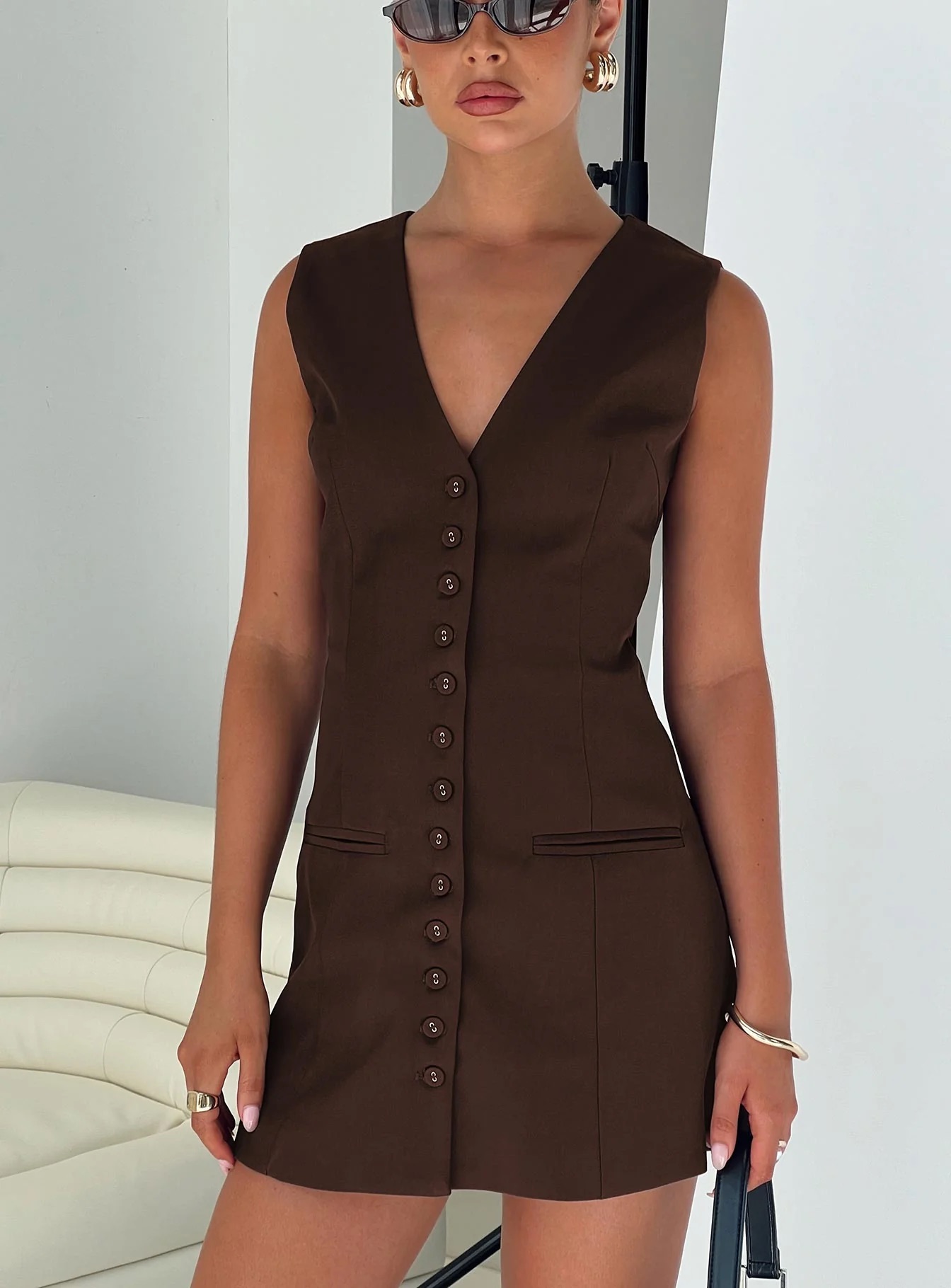woman wearing chocolate mini dress for work