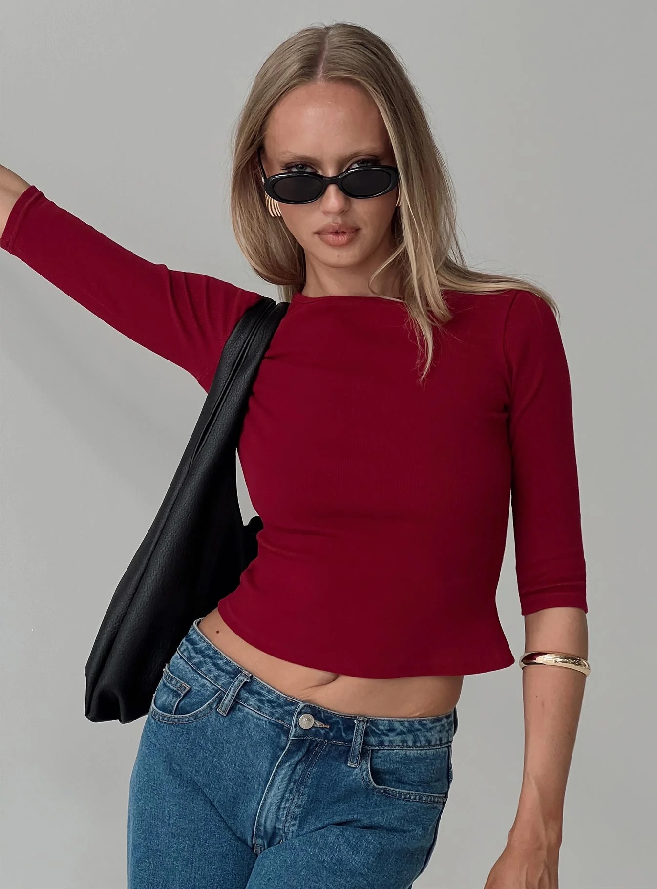 woman wearing red 3/4 sleeve top for work
