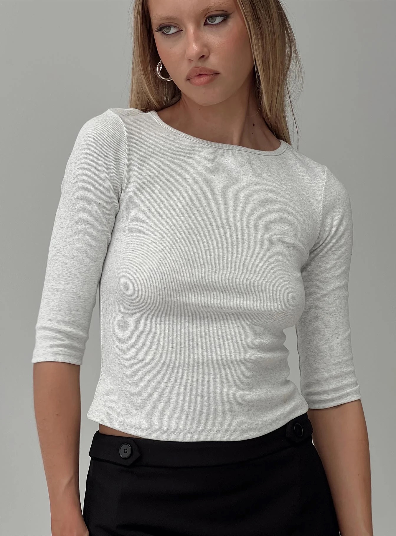 woman wearing grey 3/4 sleeve top to work from home