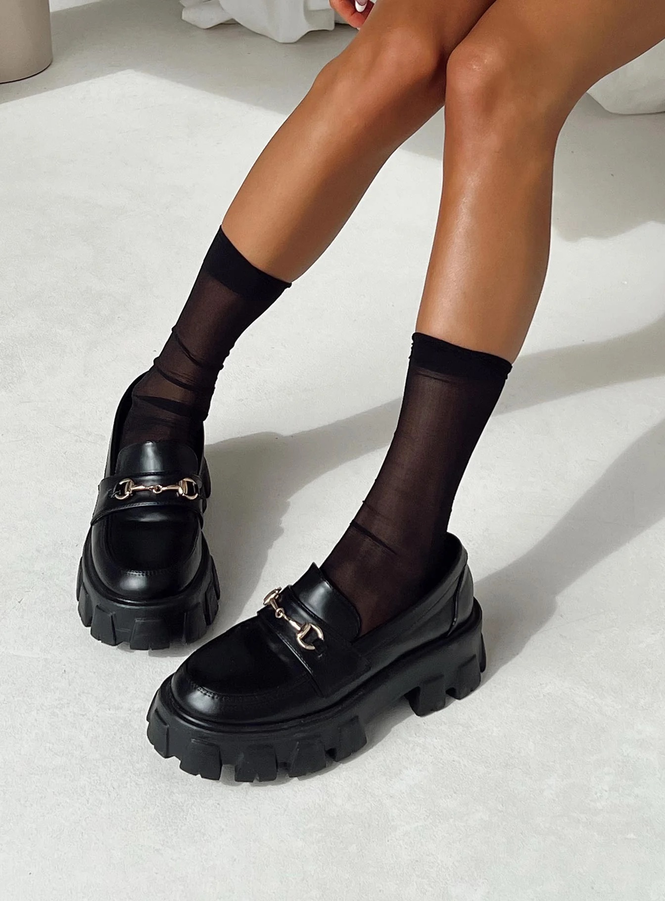 woman wearing black loafers to work