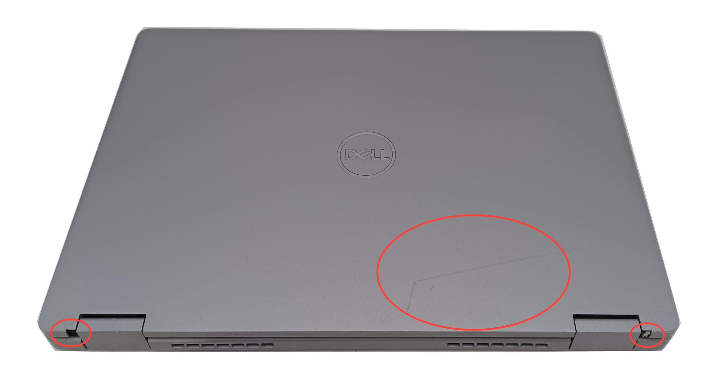 Device #1 - scratched lid + missing small rubber hinge covers.