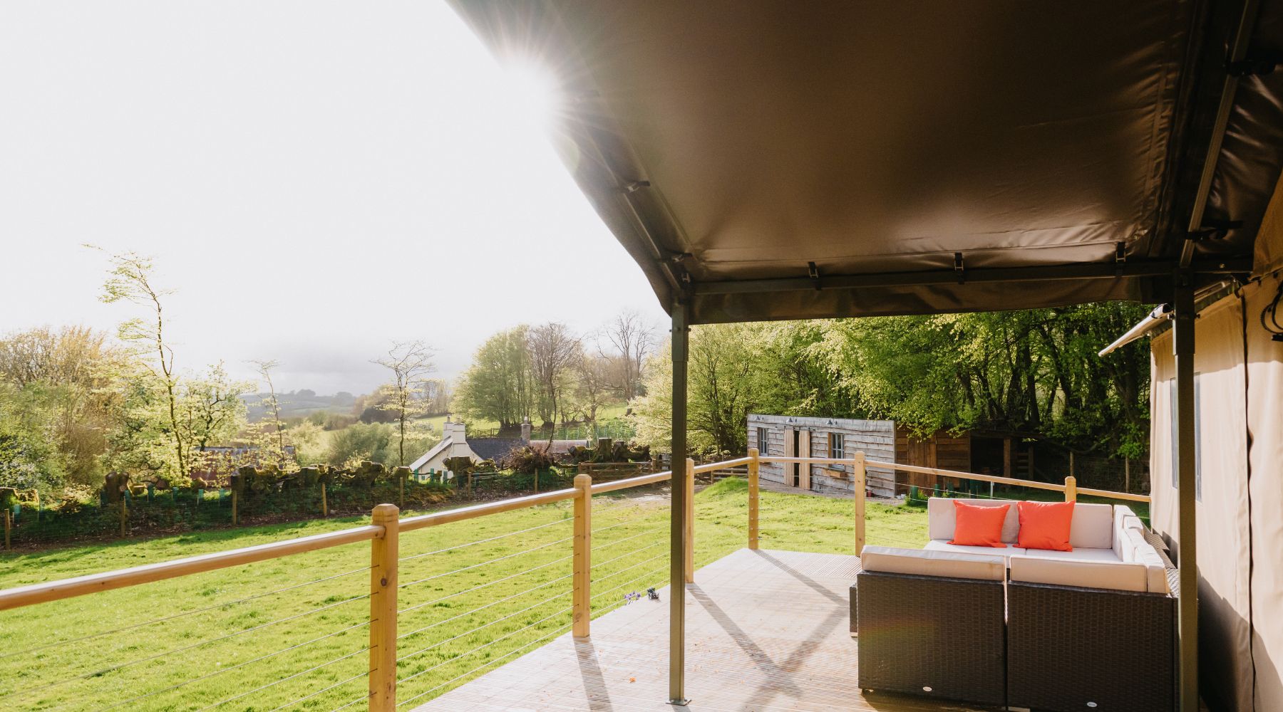 Accessible deck outside Flora and Fauna safari tent with countryside beyond