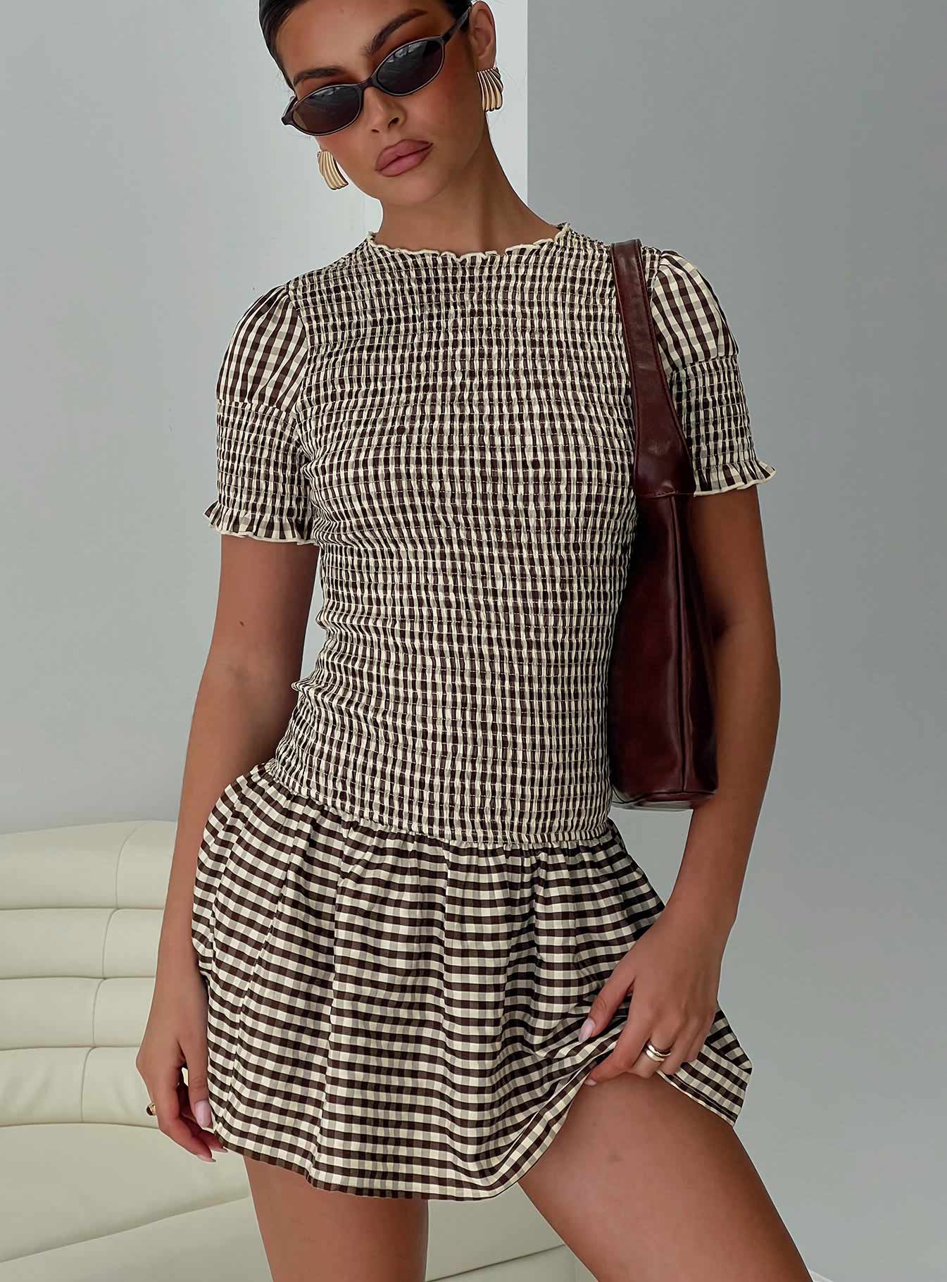 woman wearing shirred dress