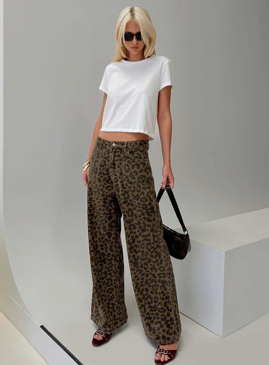 woman wearing printed jeans