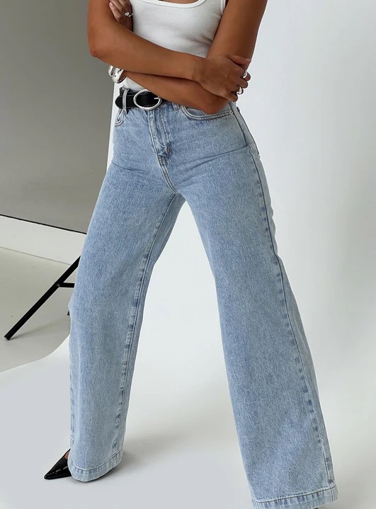 woman wearing wide leg light wash jeans