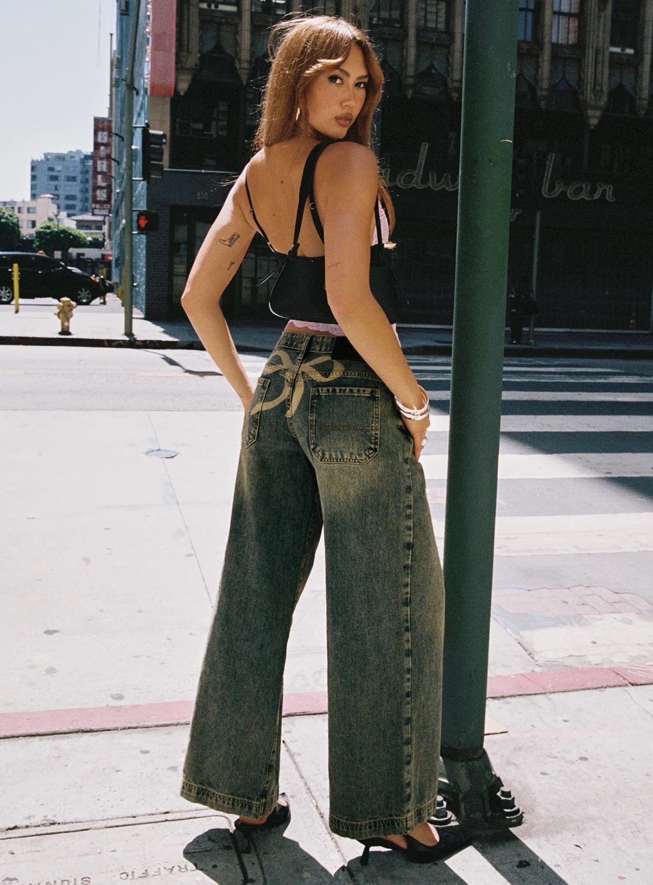 woman wearing wide leg low rise jeans