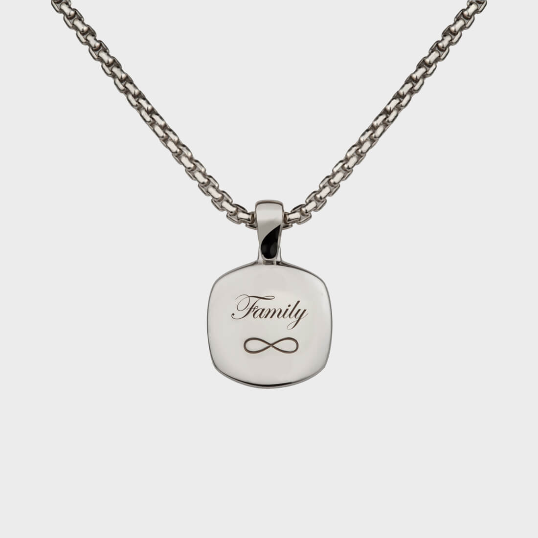 A sterling silver signet necklace with the word 'family' and the infinity sign engraved on it at the back