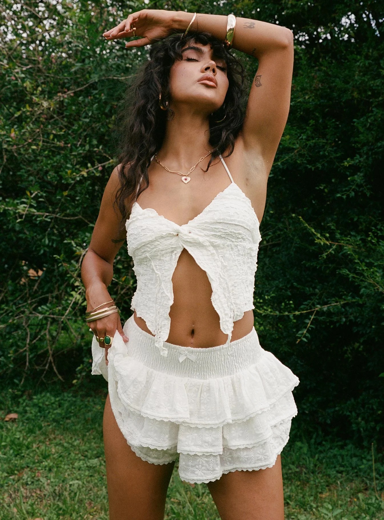 woman wearing white skort with cowgirl boots