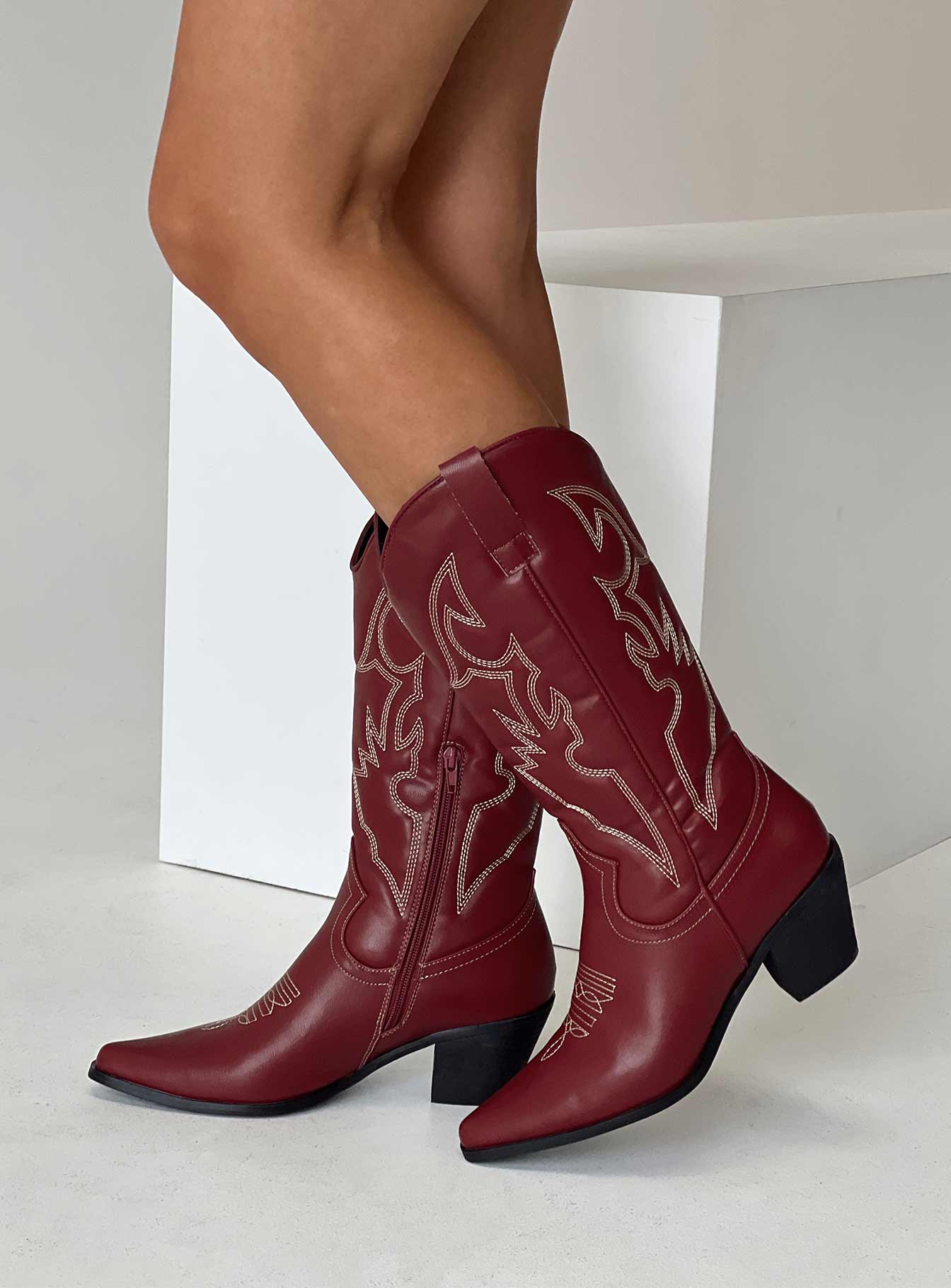 woman wearing cowgirl boots 2025
