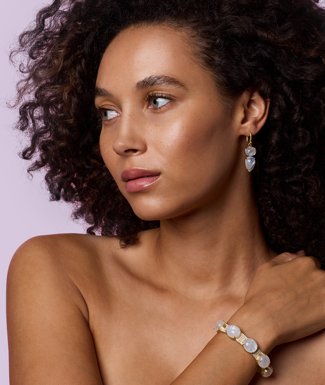 Ever-glowing stones lend radiance to our gold cuffs.