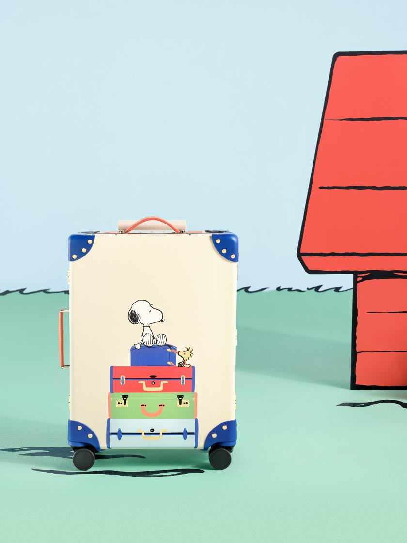 Globe-Trotter x PEANUTS Collaboration. Carry-On (Cabin) Suitcase Featuring Snoopy and Woodstock in Ivory and Cobalt Blue.