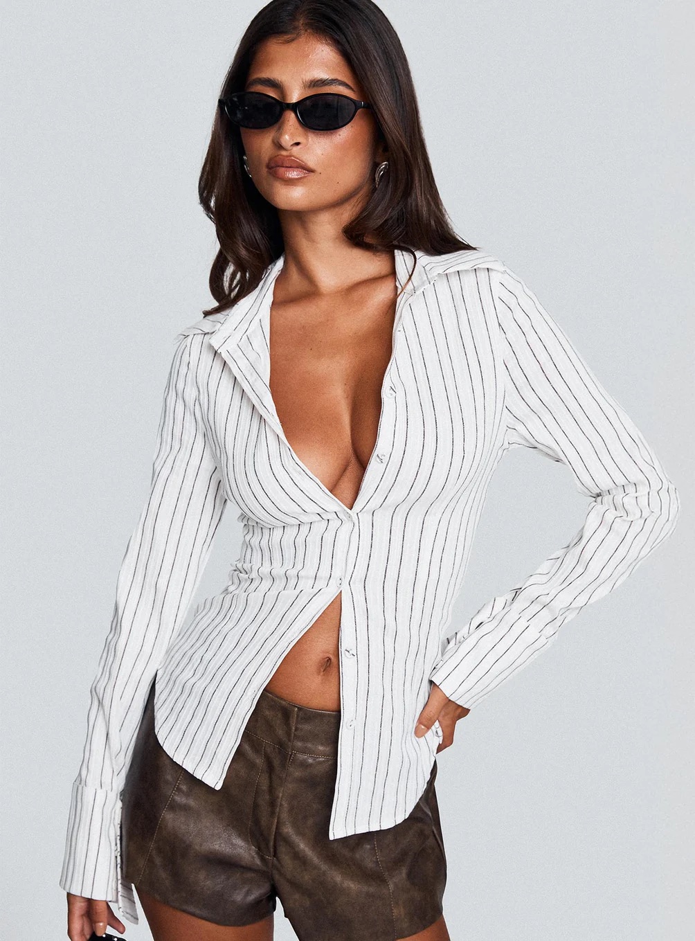 woman wearing a Princess Polly Cool Girl top