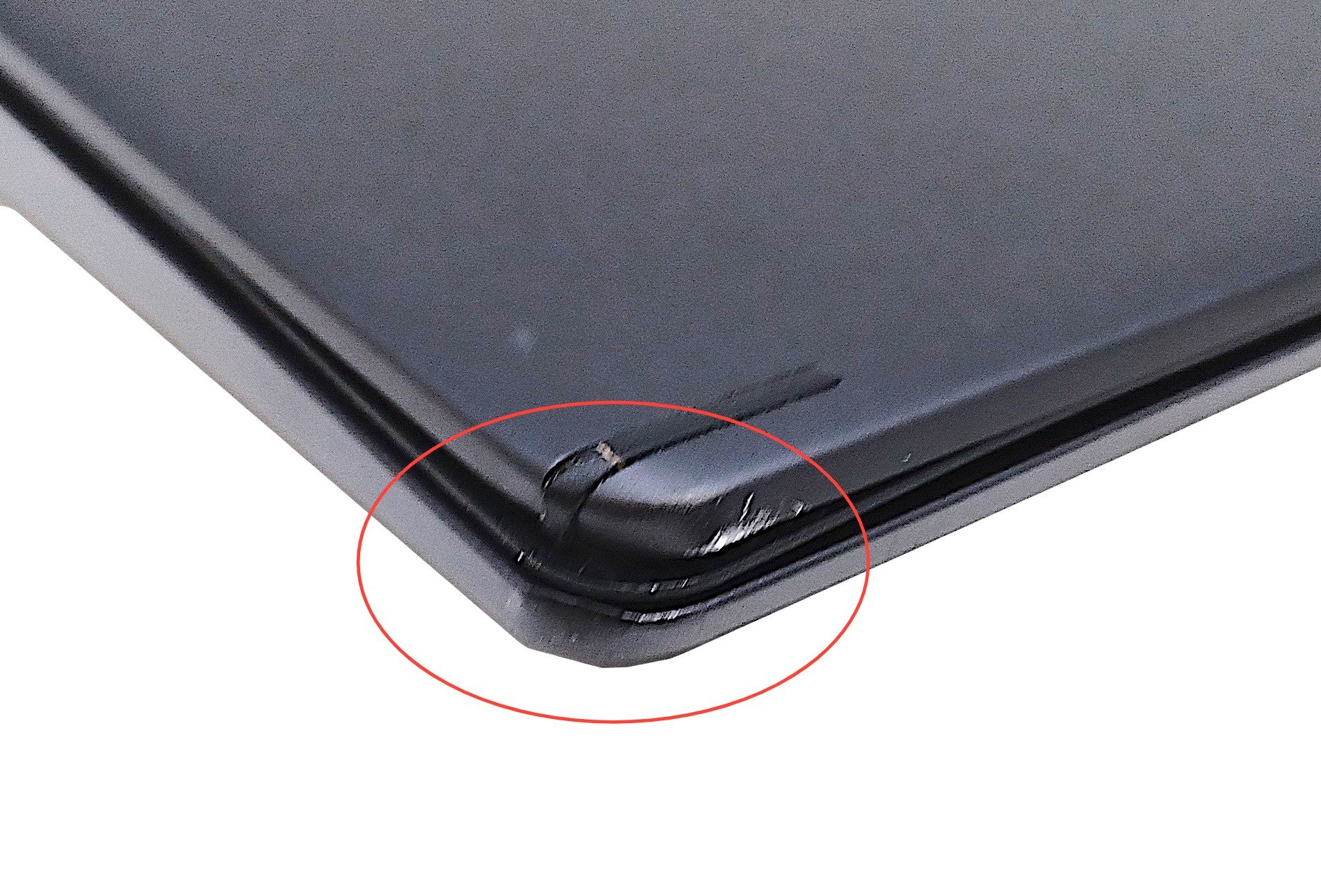 Device #1 - front left corner of lid/case dented