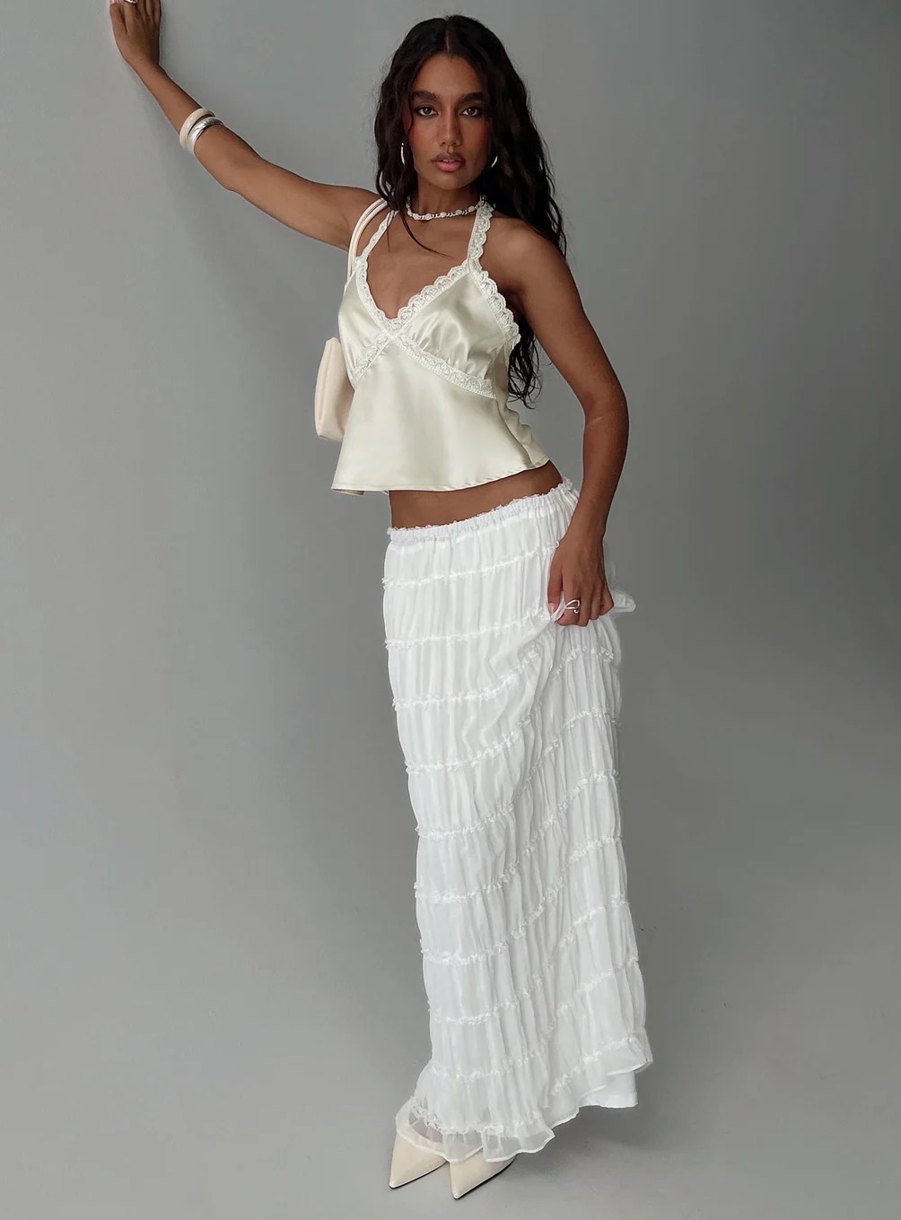 woman wearing princess polly white maxi skirt