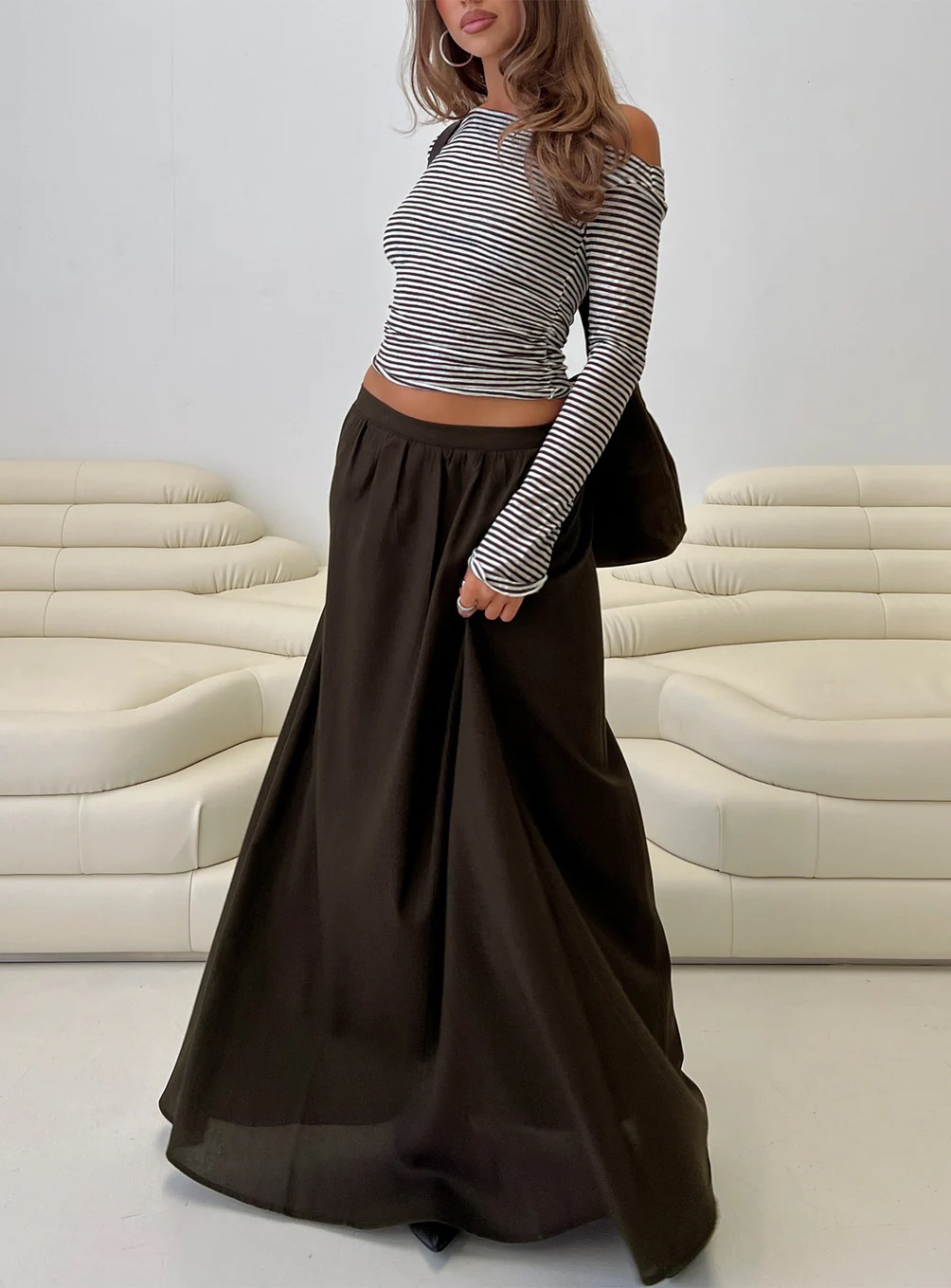 woman wearing princess polly brown maxi skirt