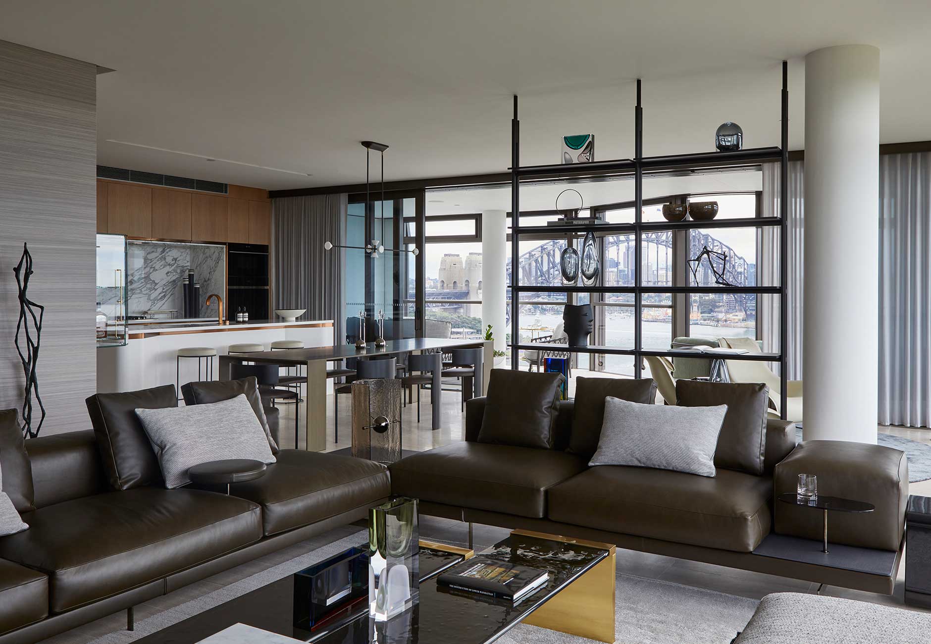 The open-plan living space featuring a B&B Italia Dock low sofa and B&B Italia Jack shelving unit. Photo © Martin Mischkulnig.