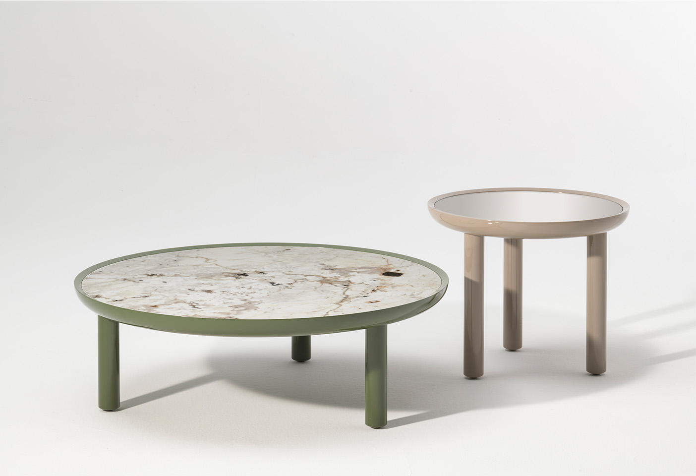 Rodolfo Dordini's K-Top tables for Kartell, with high-gloss lacquered legs and tops with a variety of finishes, including a refined ceramic version: mirrored, dove grey, green, black and marble effect. Photo c/o Kartell.