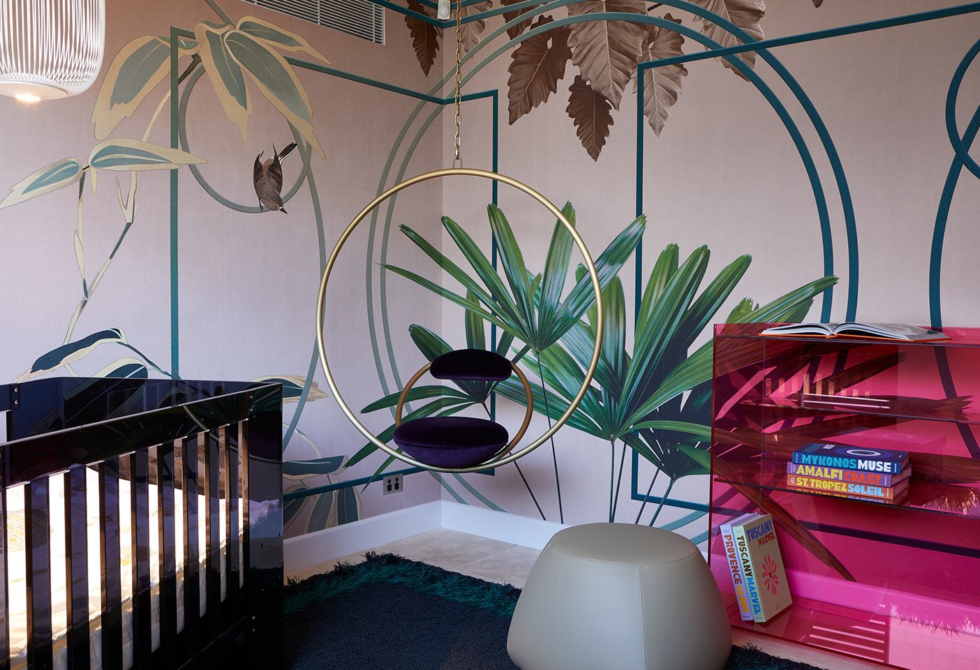 The brief here was to create a nursery like no other. A colourful wall-finishing by Glamoura adds an element of theatricality to a traditionally quiet room, while a swing by Lee Broom brings motion and energy to the space.