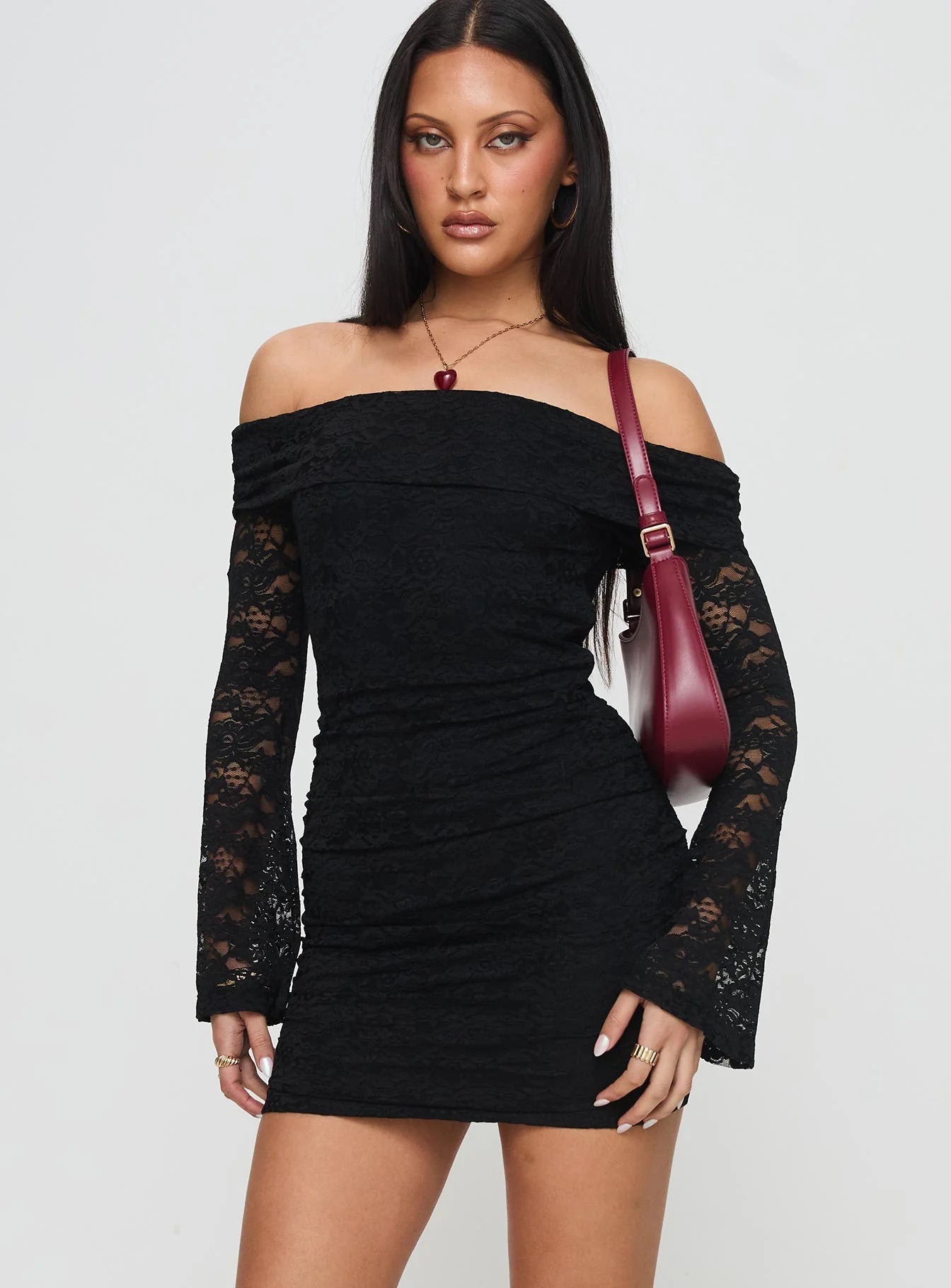 woman wearing princess polly black dress for fall date night