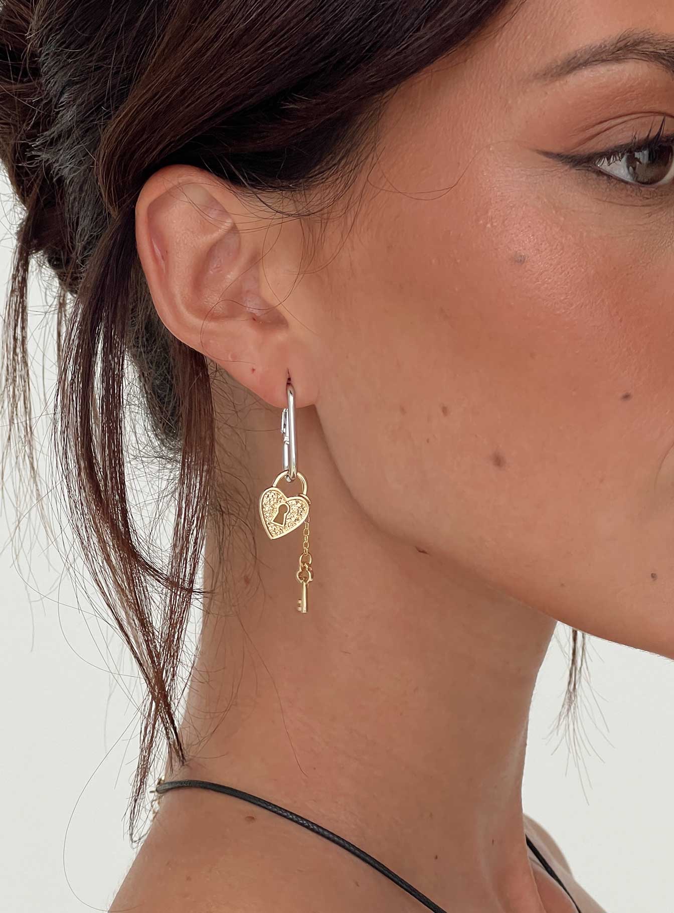 woman wearing princess polly earrings for fall date night