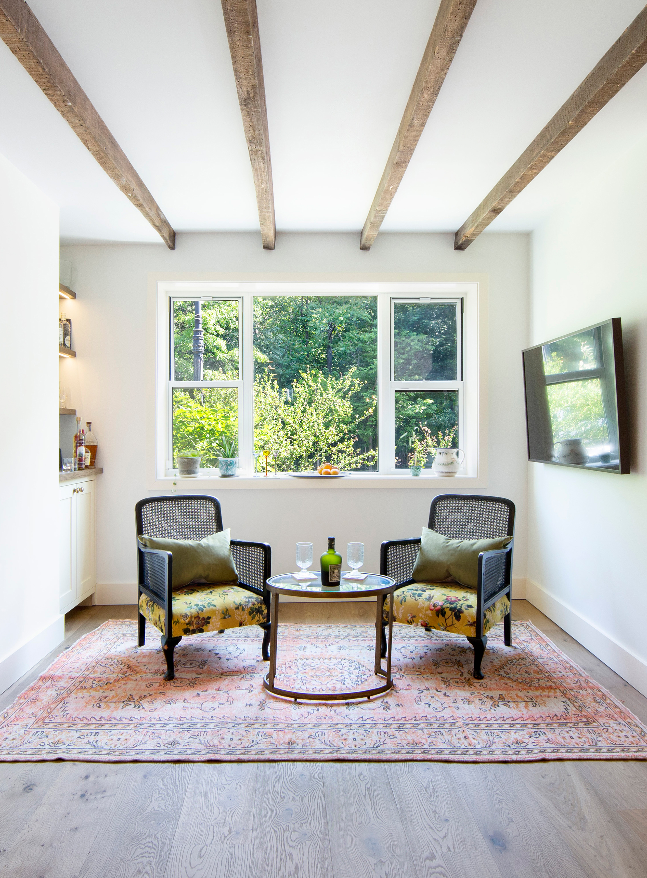 Custom hardwood flooring extending through open concept Prospect Park SW living area