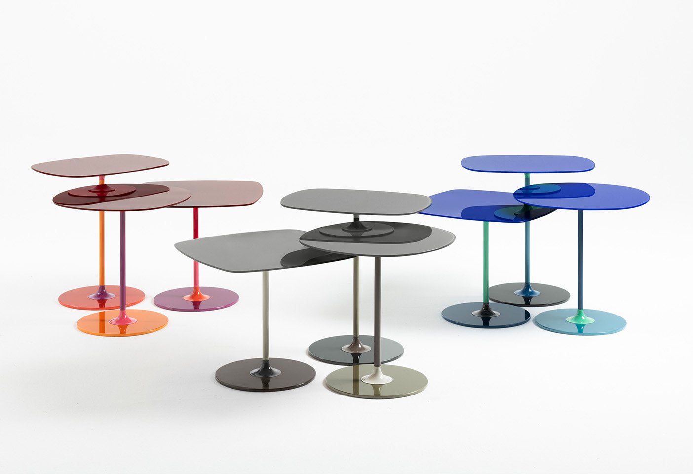 The Thierry tables in all their colour combinations and sizes designed by Piero Lissoni for Kartell. Photo c/o Kartell.