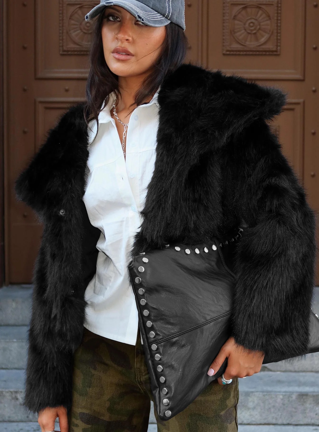 woman wearing princess polly black faux fur jacket