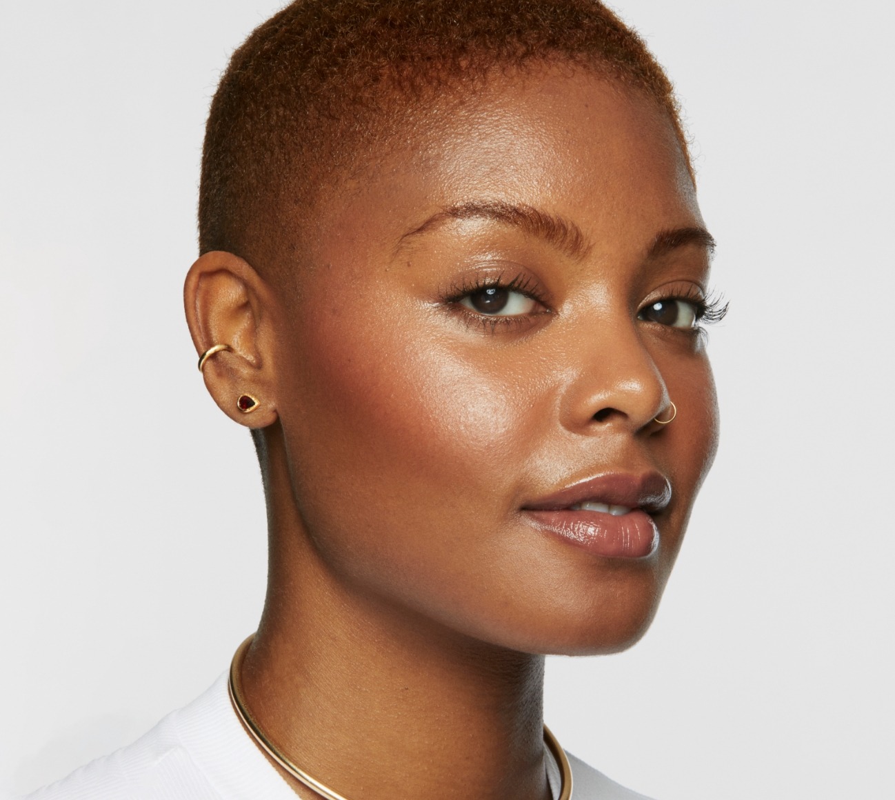 Portrait shot of a model wearing Milk Makeup products on a white background