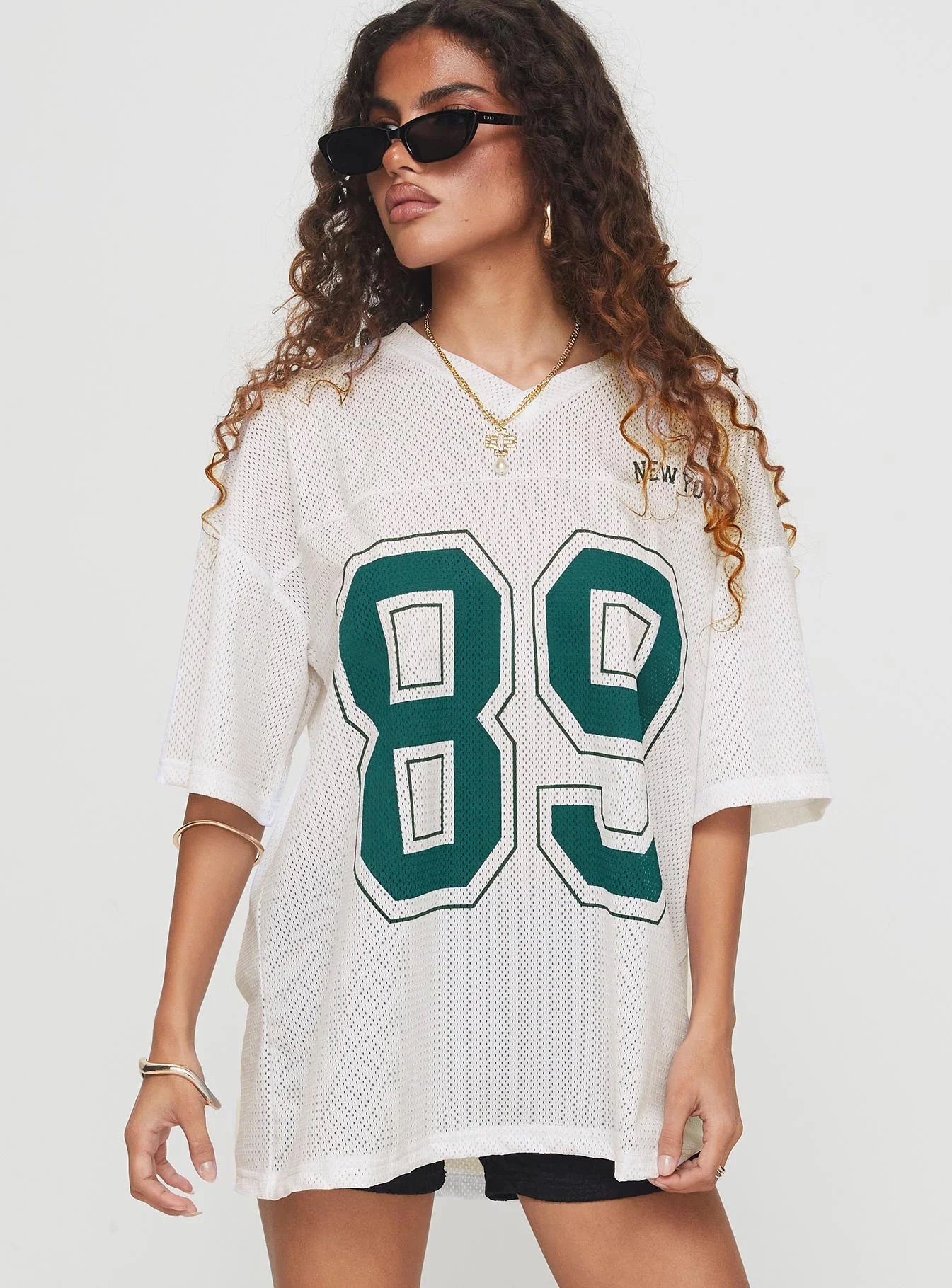 woman wearing princess polly graphic tee to baseball game