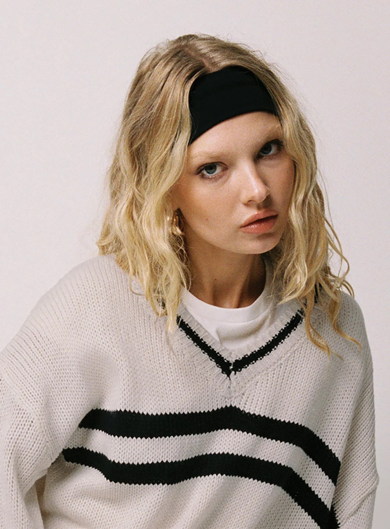 woman wearing princess polly headband to baseball game