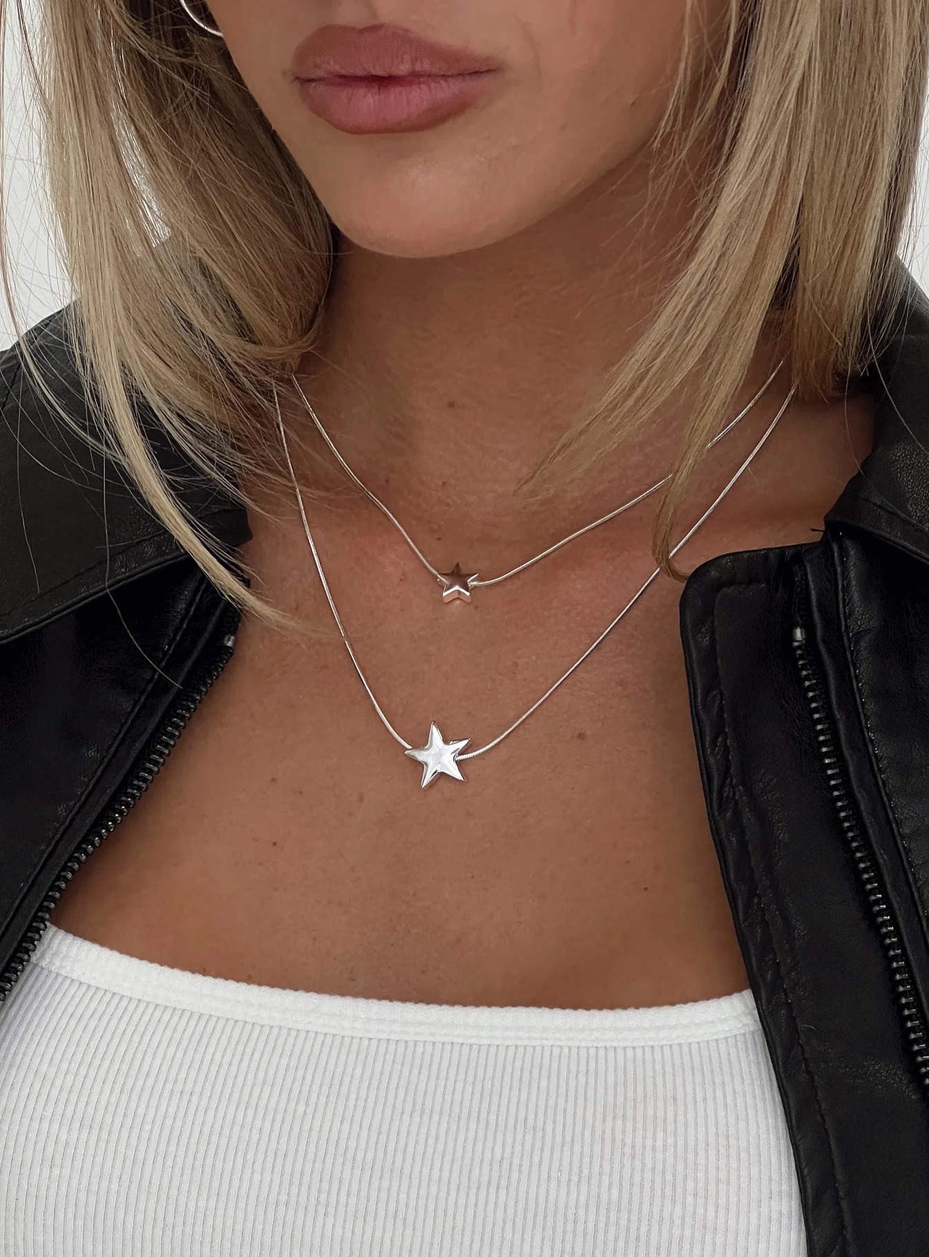 woman wearing princess polly star necklace to baseball game