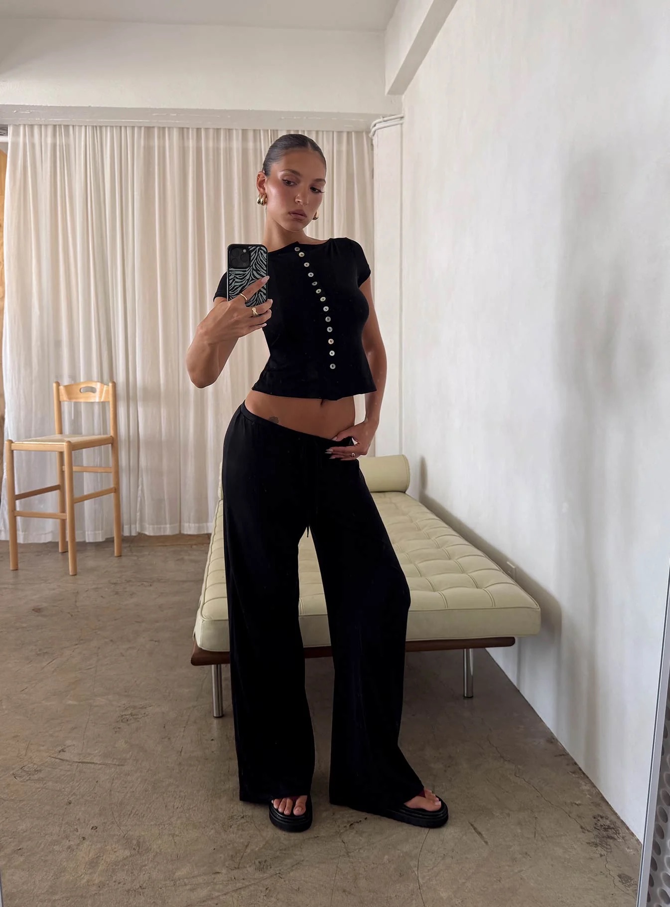 woman wearing princess polly wide leg pants working from home
