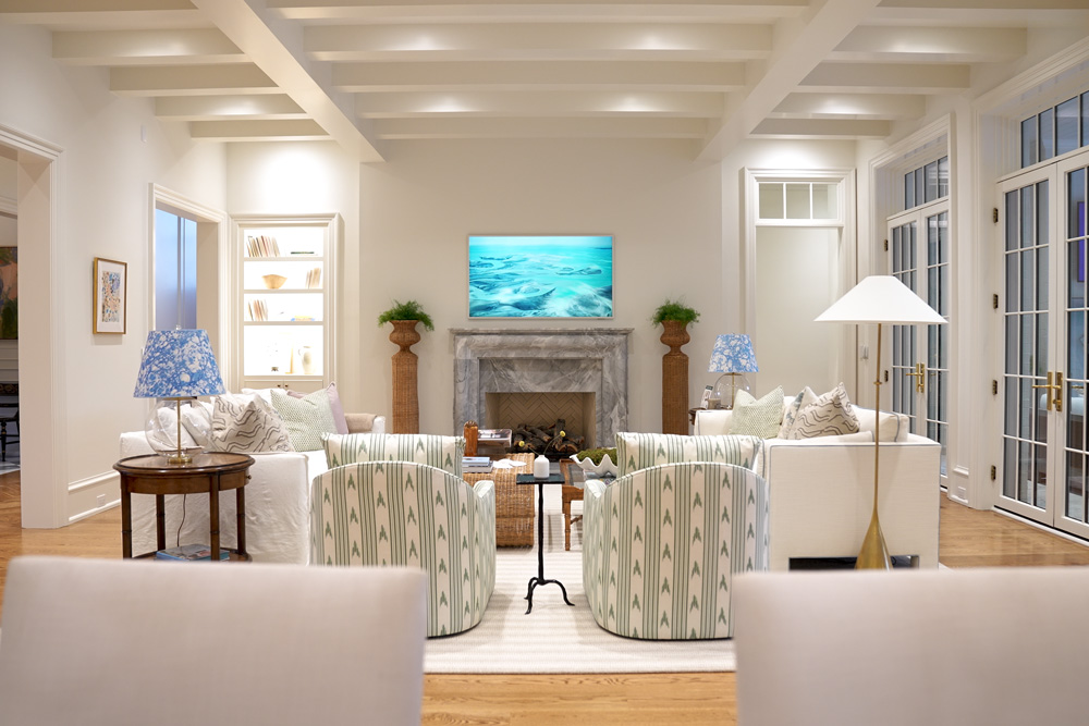 Living room in smart home with mounted televsion and seating
