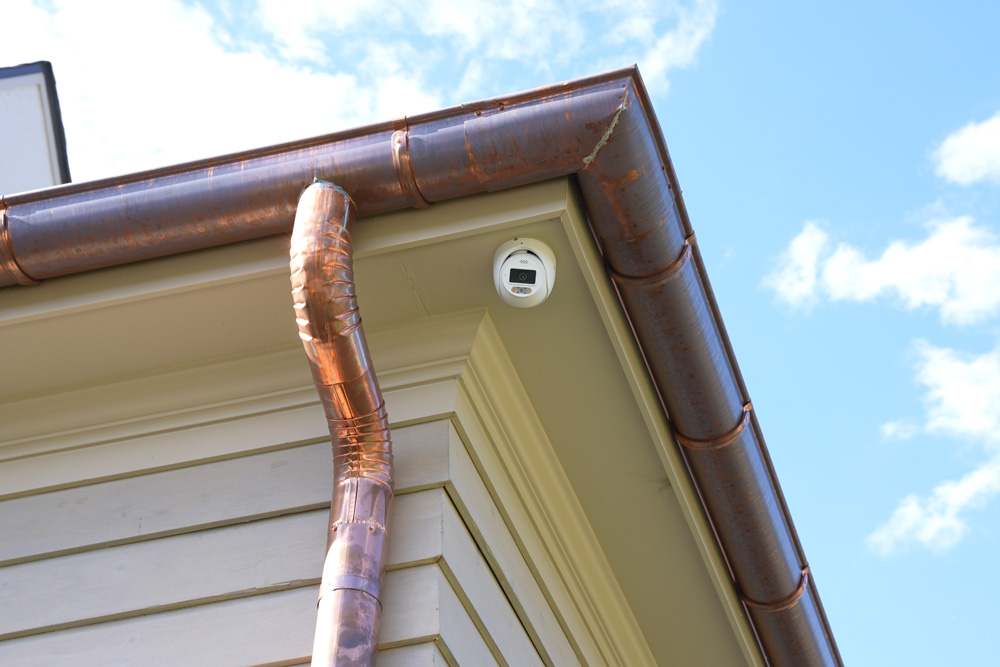 Security camera mounted on the outside of a home