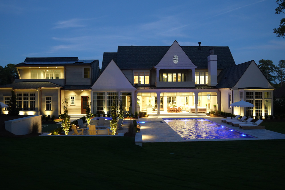 Backyard and home illuminated at night